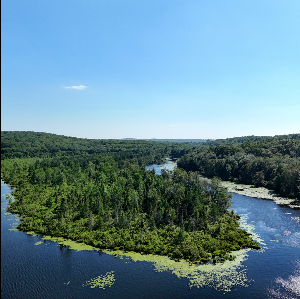 The tablet displays a digital image of what appears to be a roof that is being inspected by a drone.